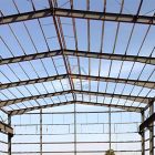 What is the first step in building a steel structure factory?